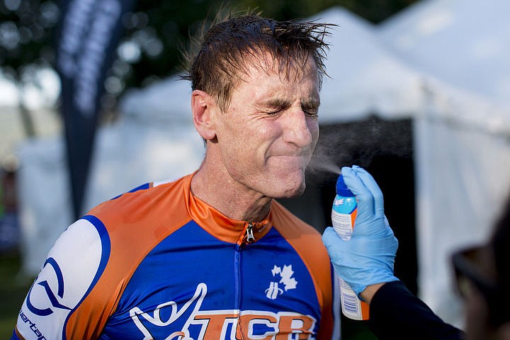 &lt;p&gt;JAKE PARRISH/Press Timothy Reimink of Miami, Florida is sprayed with sunscreen as he prepares for the 112-mile bike portion.&lt;/p&gt;