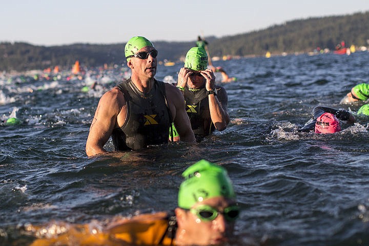 &lt;p&gt;More than 1,300 athletes from around the world gathered on Coeur d'Alene's City Beach on the morning of August 21, 2016 for the start of the 14th annual Ironman Coeur d'Alene triathlon. Participants were challenged to a 2.4-mile open water swim in Lake Coeur d'Alene, followed by a 122-mile bike ride and finishing the race with a 26.2-mile run. Thousands of spectators cheered on the athletes as they raced through the 94-degree weather for the event. To purchase photo, please visit www.cdapress.com/photos&lt;/p&gt;