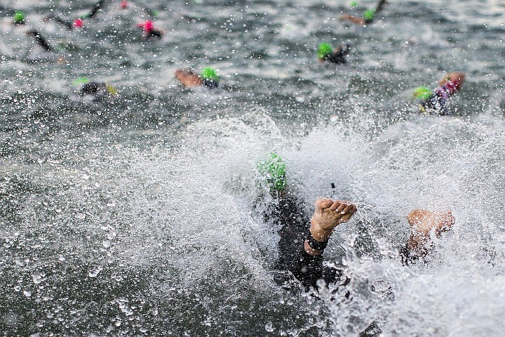 &lt;p&gt;More than 1,300 athletes from around the world gathered on Coeur d'Alene's City Beach on the morning of August 21, 2016 for the start of the 14th annual Ironman Coeur d'Alene triathlon. Participants were challenged to a 2.4-mile open water swim in Lake Coeur d'Alene, followed by a 122-mile bike ride and finishing the race with a 26.2-mile run. Thousands of spectators cheered on the athletes as they raced through the 94-degree weather for the event. To purchase photo, please visit www.cdapress.com/photos&lt;/p&gt;