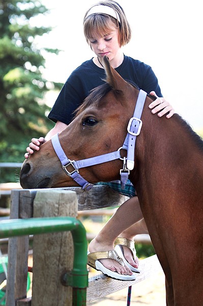 Alli Bondurant, 13, of Kalispell, with her horse Sundance on Tuesday in Kalispell. Bondurant competed in the showmanship and costume class at the Northwest Montana Fair. Sundance did not place, but did make it into the finals in showmanship.