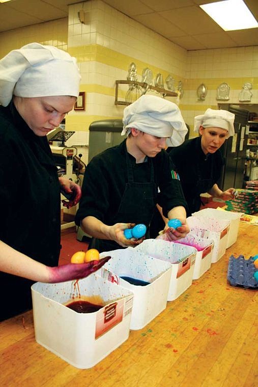 Moses Lake Job Corps culinary students color eggs for the community Easter egg hunt in March. The organization's welding program and some staff positions will be cut this year.