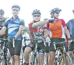 &lt;p&gt;Jason Sokolosky, left, Gord Parker and Katrina Brawner of the Calgary Outdoor Club, await the start of the second annual Le Tour de Koocanusa bicycle tour along the shoreline of Lake Koocanusa. Parker points left, the direction the tour will take for the first half mile, then it's a sharp right and the beginning of an unforgiving 2.4 mile hill climb.&lt;/p&gt;