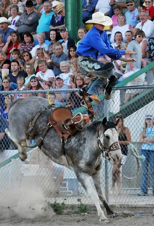 Jason Biel of Glasgow catches some air and almost flies into the fence after his horse gave him enough kick toward the end of his saddle bronc ride during at the Northwest Montana Rodeo Thursday evening.