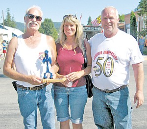 &lt;p&gt;Lynn and Susie Main of Spokane Valley, Wash., stand with Igniters announcer Gary Rantala, right, on Saturday after winning the Peoples&#146; Choice Award for their 1929 Ford Sedan Delivery. The candy brandy-wine colored sedan featured ghost flames. &#160;&lt;/p&gt;