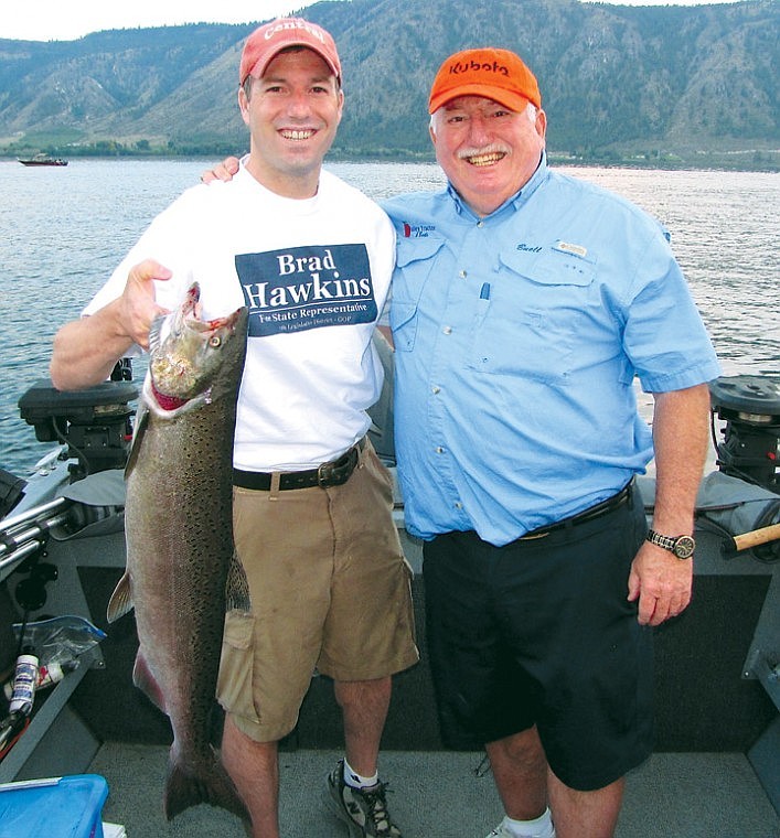 Brad Hawkins (left) and his dad Buell are very pleased with this king caught in the Brewster Pool. Kings are being caught in very good numbers off the mouth of the Okanogan River right now.