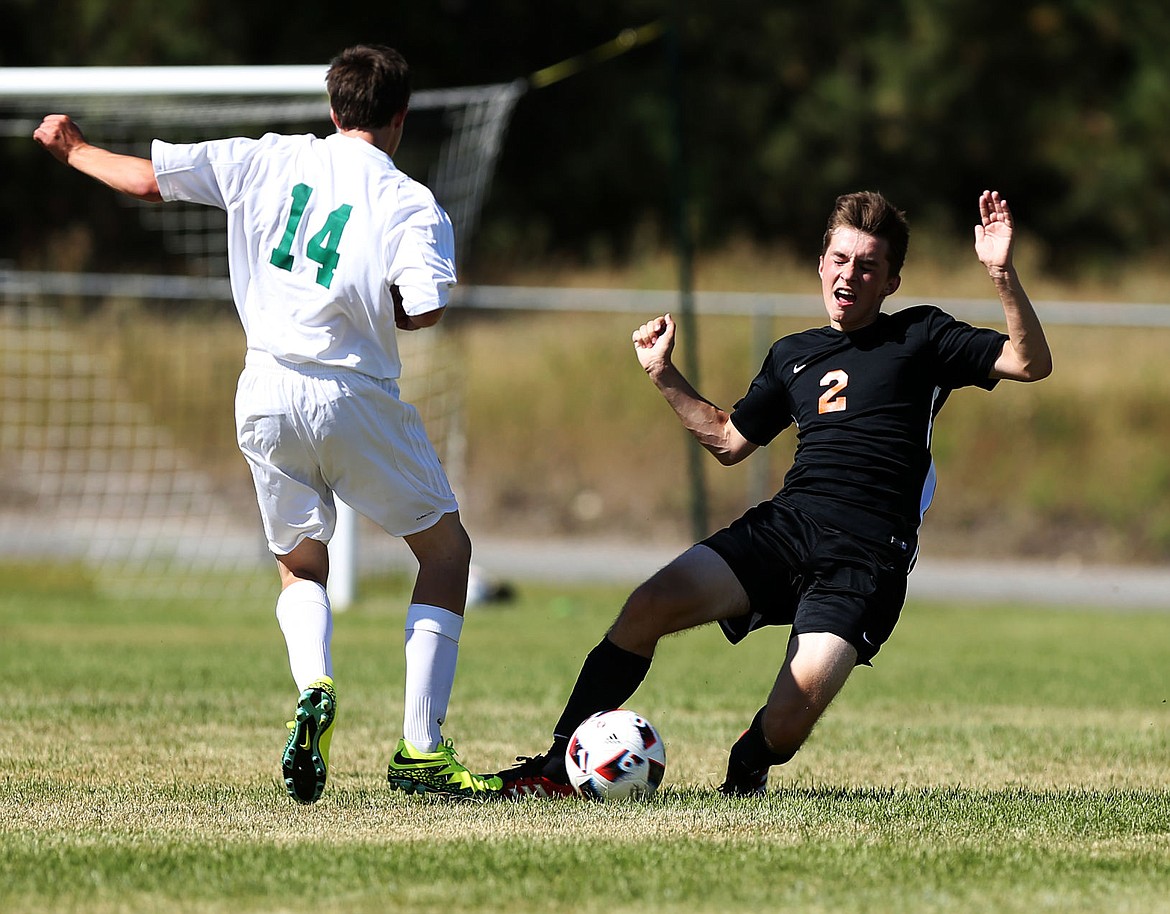 &lt;p&gt;LOREN BENOIT/Press Post Falls defender Robert Butterfield, right, slides for the ball to stop Lakeland's Tommy Krivenak from passing the ball during the non-league opener on Saturday in Rathdrum. Post Falls won 3-1.&lt;/p&gt;