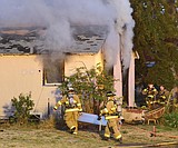 Men escape, but house destroyed in fire