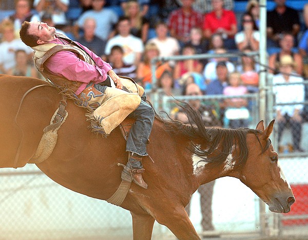 Troy Solomon, of Havre competing in the Bareback Riding competition on Friday at the Northwest Montana Fair.