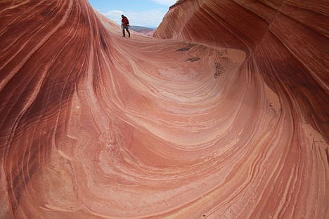 &lt;p&gt;In this May 28, 2013, file photo, a hiker walks on a rock formation known as The Wave in the Vermilion Cliffs National Monument in Arizona.&lt;/p&gt;