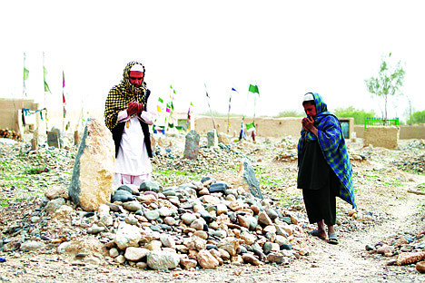 &lt;p&gt;FILE - In this Saturday, March 24, 2012 file photo, villagers pray over the grave of one of the sixteen victims killed in a shooting rampage in the Panjwai district of Kandahar province south of Kabul, Afghanistan. It was once President Barack Obama's &quot;war of necessity.&quot; Now, it's America's forgotten war. The Afghan conflict generates barely a whisper on the U.S. presidential campaign trail. It's not a hot topic at the office water cooler or in the halls of Congress _ even though 88,000 American troops are still fighting here and dying at a rate of one a day.(AP Photo/Allauddin Khan, File)&lt;/p&gt;