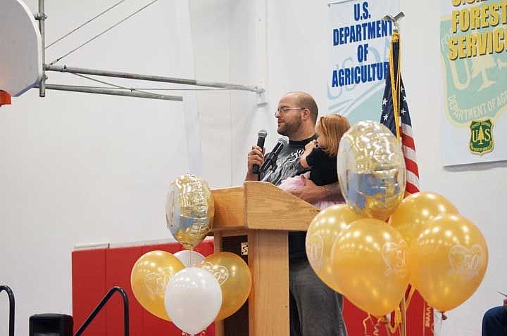 Genie welder and Job Corps graduate Anthony Quinn, (holding his daughter), shares how Job Corps helped direct him into a well-paying job. Job Corps celebrated its 50-year anniversary Wednesday.