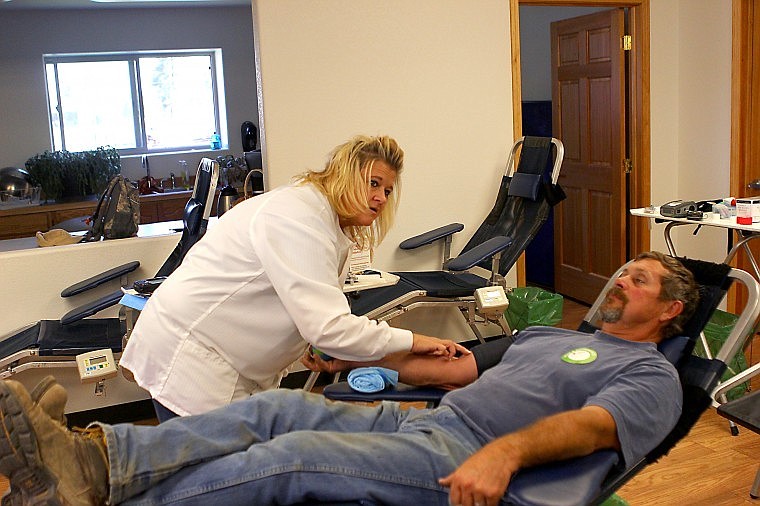 &lt;p&gt;Charlie Moser, a member of the Lewiston Idaho American Red Cross team, prepares Jim Lommen of Superior for his blood donation during a blood drive on Thursday.&lt;/p&gt;