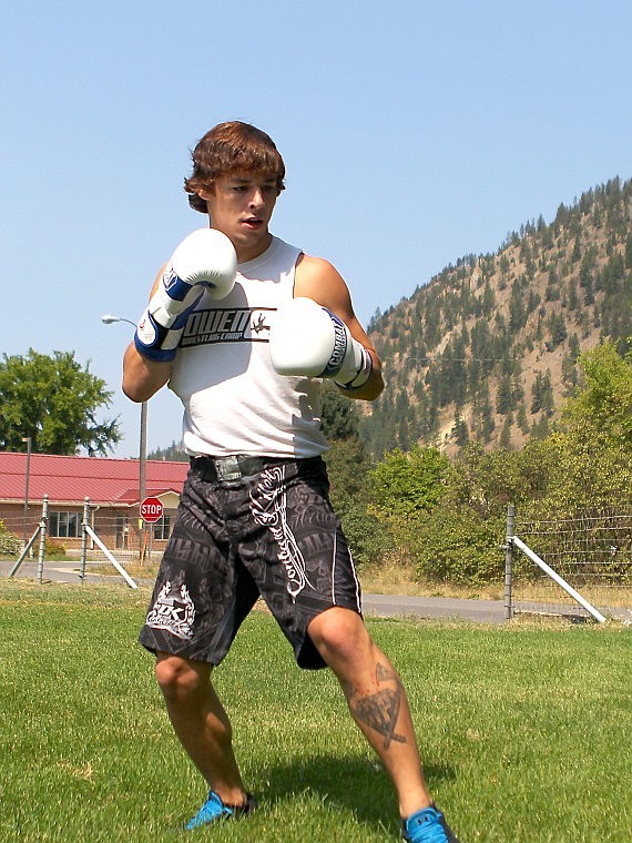 <p>Josh Wright practices his MMA technique at his Superior home.</p>