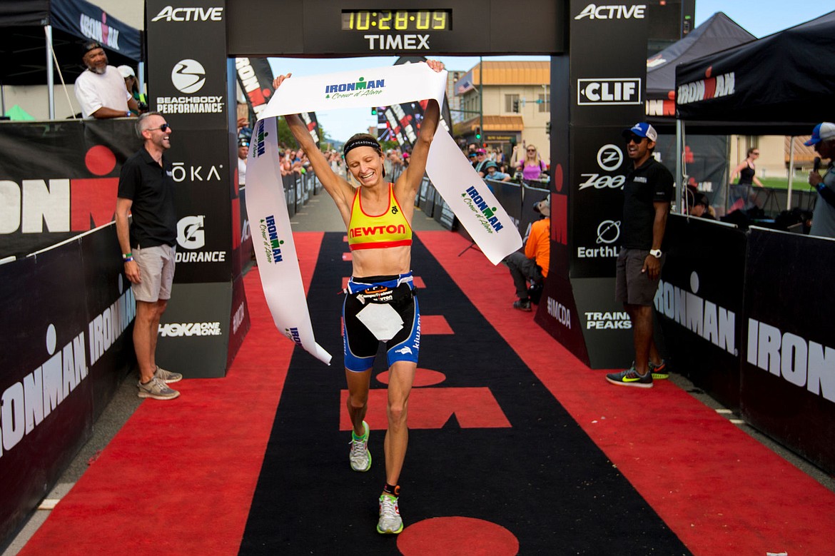 &lt;p&gt;JAKE PARRISH/Press Morgan Busko of New York holds up the Ironman Coeur d'Alene finish line tape after finishing with a time of ten hours, 24 minutes and 45 seconds, marking her as the fastest female in the race.&lt;/p&gt;