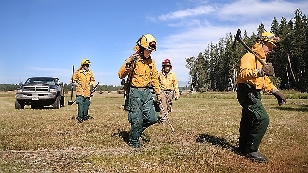 &lt;p&gt;Firefighters Joe Brenneman, River Mallery, John Klippel and Carl
Strand head into deep brush in the Lake Blaine area Monday morning
as they look for a fire that had been spotted from the sky. The
smoke was the result of a slash pile burn.&lt;/p&gt;