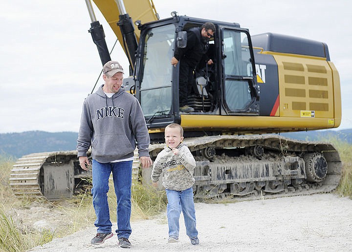 &lt;p&gt;Colton Engeland, 5, is too excited to walk and starts to run as his dad Daniel Engeland takes him away from the excavator he just helped drive. (Aaric Bryan/Daily Inter Lake)&lt;/p&gt;