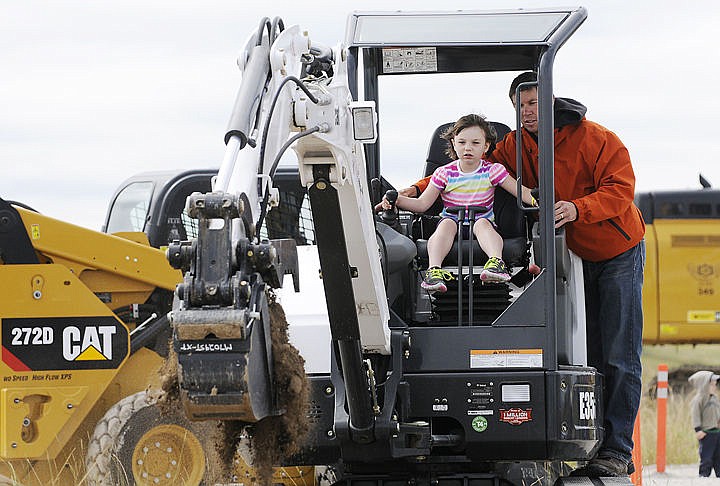 &lt;p&gt;Blayke Shenefelt, 4, dumps a scoop of dirt with the help of Dan Hodge during Gravelpalooza. (Aaric Bryan/Daily Inter Lake)&lt;/p&gt;