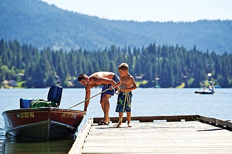 &lt;p&gt;JEROME A. POLLOS/Press Michael Johnson, 7, helps his father, Adam Johnson, load their boat Aug. 16 after an afternoon of fishing and playing on Hayden Lake. The Sportsman Park boat ramp at Hayden Lake was recently expanded and improved by creating more than 40 parking spaces and the access road can now accommodate two vehicles. The new boat ramp is 20 feet long and has an expanded radius to back vehicles with trailers down the ramp, making boat launching faster, safer and easier, according to the Idaho Department of Fish and Game.&lt;/p&gt;