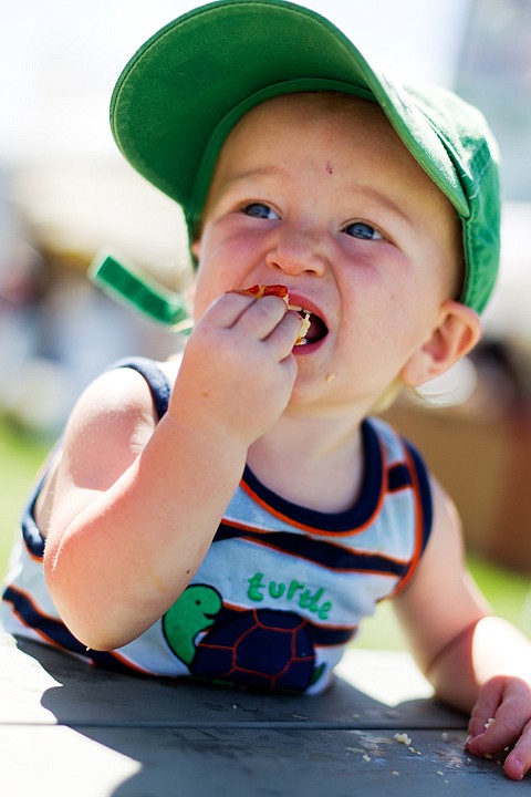 &lt;p&gt;SHAWN GUST/Press Kash Haynes, 1, enjoys his first hand-dipped corn dog at the fair food court.&lt;/p&gt;