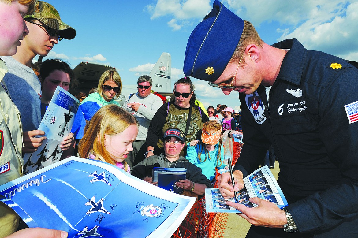 &lt;p&gt;Curtis autographs a brochure for a young fan during the Thunder Over The Valley air show at Youngstown Air Reserve Station, Ohio, on May 18. (U.S. Air Force photo/Staff Sgt. Larry E. Reid Jr.)&lt;/p&gt;