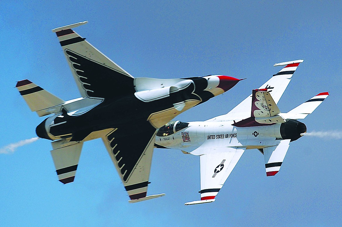 &lt;p&gt;Maj's. Blaine Jones, Thunderbird 5, Lead Solo and Jason Curtis, Thunderbird 6, Opposing Solo, perform the Opposing Knife-Edge Pass during the 2014 Cannon Air Force Base Air Show and Open House. (U.S. Air Force photo/Staff Sgt. Larry E. Reid Jr.)&lt;/p&gt;