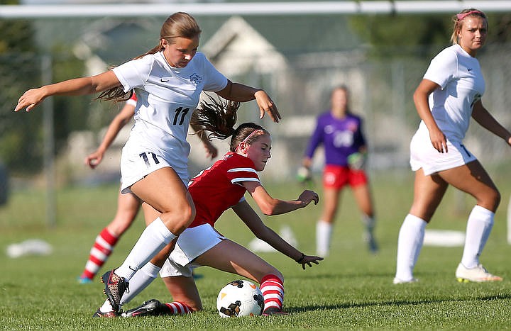 &lt;p&gt;JAKE PARRISH/Press Lake City senior Caitlin Barber dribbles past Holly Kassa of Sandpoint on Tuesday at Lake City High School.&lt;/p&gt;