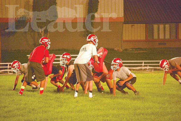 &lt;p&gt;&lt;strong&gt;Several Arlee players line up to practice a play early on Friday morning. Coach Mike Rogers has 14 players out for his varsity squad.&lt;/strong&gt;&lt;/p&gt;