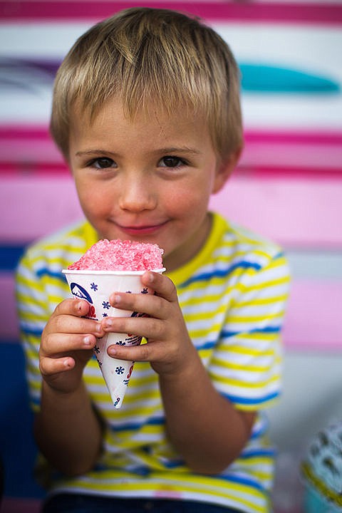 &lt;p&gt;TESS FREEMAN/Press&lt;/p&gt;&lt;p&gt;Skeet Peloza, 4,&#160;enjoys a snow cone at the North Idaho Fair and Rodeo on Thursday afternoon. Over 200 venders selling an assortment of food, arts, and crafts were at the North Idaho Fair and Rodeo.&lt;/p&gt;