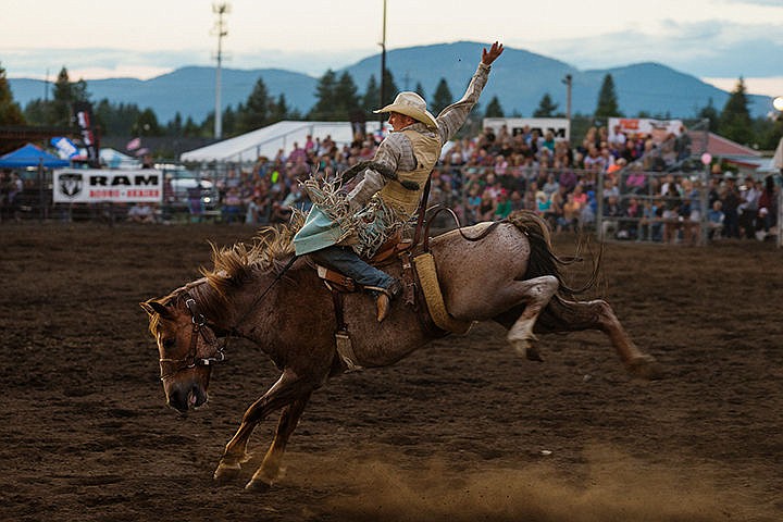 &lt;p&gt;SHAWN GUST/Press&lt;/p&gt;&lt;p&gt;Caleb Nichols, of Priest River, competes in the saddled bronc ride event of the Professional Rodeo Cowboys Association rodeo Friday at the North Idaho Fair and Rodeo in Coeur d&#146;Alene.&lt;/p&gt;