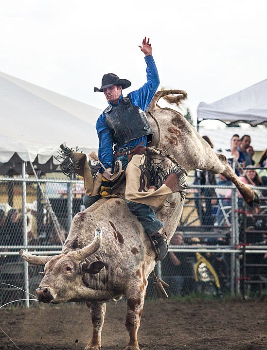 &lt;p&gt;Brian Richard Carter of Pendleton, Ore. manages to hold on to the bull Hall Pass for the golden eight seconds Thursday at the Xtreme Bull rodeo show at the North Idaho Fair and Rodeo. The Fair continues through Sunday at the Kootenai County Fairgrounds.&lt;/p&gt;