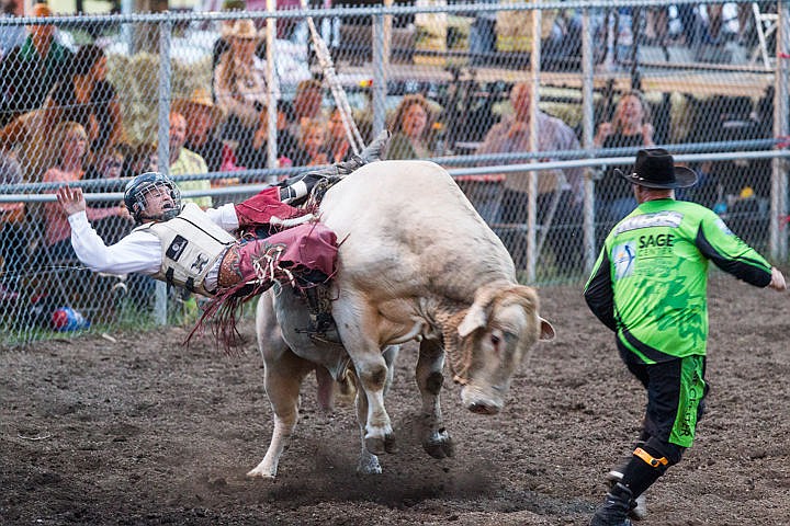 &lt;p&gt;JAKE PARRISH/Press&lt;/p&gt;&lt;p&gt;Chandler Bownds of China, Texas holds on for life while riding bull weighing about 1,800 pounds during the Xtreme Bulls rodeo show at the Main Arena at the Kootenai County Fairgrounds.&lt;/p&gt;