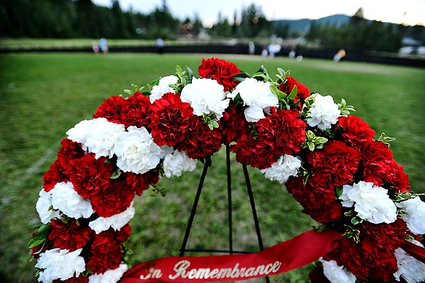 <p>A wreath laid In Remembrance with The Moving Wall Vietnam Veterans Memorial in the background on Thursday, August 22, in Whitefish. (Brenda Ahearn/Daily Inter Lake)</p>