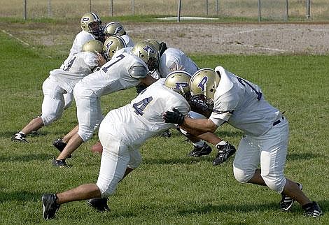Ethan Smith/Leader<br>Polson lineman practice their drills on Monday. The Pirates will start their season at home on Friday against Hamilton.