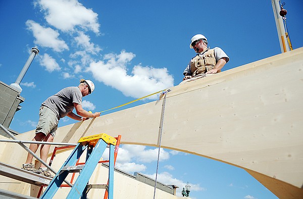 &lt;p&gt;Jeff Bounds, left, of Compass Construction and Patrick Clark of
Innovative Timber Systems carefully measure and check the location
of a floor plate placed atop an arch on Tuesday afternoon&#160; in
Whitefish.&lt;/p&gt;