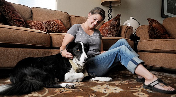 &lt;p&gt;Kate Moseley and her dog Hopkins, a two-year-old Border Collie,
sit in their livingroom on Wednesday morning in Columbia Falls.
&quot;I've taken this animal into my house and promised to raise and
take care of him,&quot; said Moseley. &quot;I can't let him suffer when I
know I could do something about it.&quot;&lt;/p&gt;