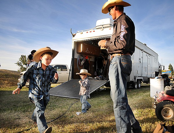 &lt;p&gt;Bull rider Beau HIll of Columbia Falls smiles as he is joined by
his sons Jace, 6, left, and Jory, 2, center, on Friday night before
the start of the rodeo at the Northwest Montana Fair in
Kalispell.&lt;/p&gt;