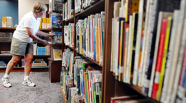 &lt;p&gt;Liz Sorlie sorts and arranges books at the library at Helena
Flats School on Wednesday afternoon as she begins to get ready for
her first year as librarian at the school. The first day of classes
is Aug. 29 at Helena Flats.&lt;/p&gt;