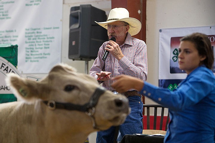 &lt;p&gt;TESS FREEMAN/Press&lt;/p&gt;&lt;p&gt;Carroll (Mac) McLean auctions off Margi Halloway&#146;s steer at the North Idaho Fair and Rodeo on Saturday morning. McLean has been an auctioneer in Kootenai County for 50 years.&lt;/p&gt;