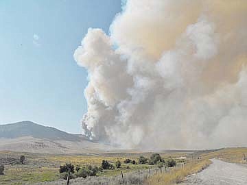 &lt;p&gt;A pillar of billowing smoke stains the sky off of Picket Road near White Earth Creek.&lt;/p&gt;