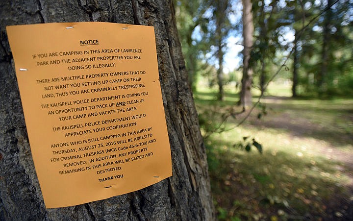 <p><strong>Signs were</strong> posted around Lawrence Park warning people camping there illegally that they had until Thursday to pack up and move out. On Thursday morning, police officers enforced their warning. (Brenda Ahearn/Daily Inter Lake)</p>