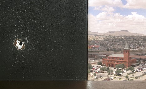 &lt;p&gt;A bullet hole from a gun battle in Juarez is seen on the wall of El Paso Assistant City Manager Pat Adauto's office in El Paso, Texas, in June. Juarez and the area where the gun fight took place can be seen out the window of Adauto's office.&lt;/p&gt;