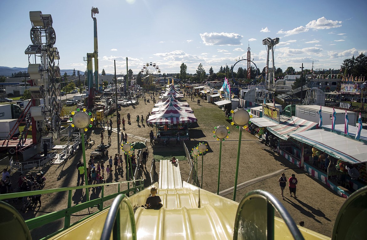 &lt;p&gt;Fair-goers walk up and down canvassing which rides to go on at the Fair on Wednesday.&lt;/p&gt;