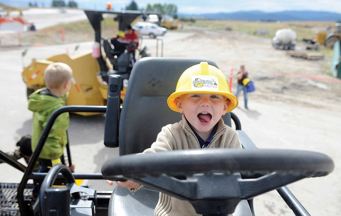 &lt;p&gt;Two-year-old Maverick Bench grabs the steering wheel of a paver during the Community Action Partnership of Northwest Montana's Gravelpalooza at the LHC gravel pit in Kalispell. Children got to help drive about 20 pieces of heavy equipment during the fundraiser. &quot;There are a lot of excited kids,&quot; said LHC owner Jeff Claridge. &quot;They love it. They just love it. And the adults love it too.&quot; (Aaric Bryan/Daily Inter Lake)&lt;/p&gt;