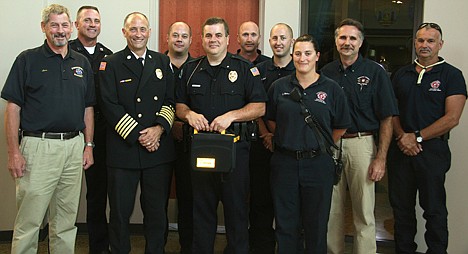 &lt;p&gt;Post Falls police officers will have automated external defibrillators (AEDs) in their cars to help save lives thanks to a partnership with Kootenai County Fire and Rescue. KCFR donated five of the portable electronic devices valued at $1,200 each to PFPD. From left are Kootenai County EMS Chief Officer Lynn Borders, PFPD Capt. Pat Knight, KCFR Chief Warren Merritt, KCFR Lt. Bryon Smith, PFPA Chief Scot Haug, KCFR Capt. Larry Sande, Firefighter/Paramedic Chris Schreiber, KCFR Firefighter Jayme Hull, KCFR Commissioner Paul Wagner and Firefighter Barry Sherman.&lt;/p&gt;