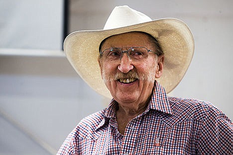 &lt;p&gt;Carroll 'Mac' McLean smiles after receiving a pair of tickets to the National Finals Rodeo in Las Vegas from his friends and colleagues in honor of his 50th year as an auctioneer.&lt;/p&gt;