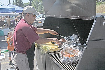 &lt;p&gt;Joe Santos of Ronan, the namesake of Smokin' Joe's, tends to the grill.&lt;/p&gt;