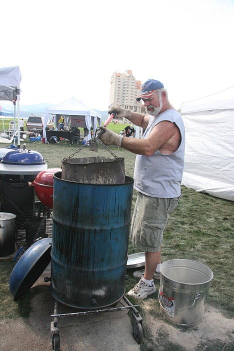 &lt;p&gt;Bill Mason of Tacoma, Wash., cleans the ashes out of a barrel Sunday afternoon in McEuen Park after his team, the &quot;Powder Hogs,&quot; participated in the weekend-long barbecue competition.&lt;/p&gt;