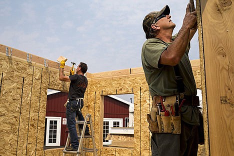 &lt;p&gt;Richard Lee, left, and Russell Little work on constructing Sip&#146;s Cabin for the North Idaho Fair on Tuesday at the Kootenai County Fairgrounds.&lt;/p&gt;