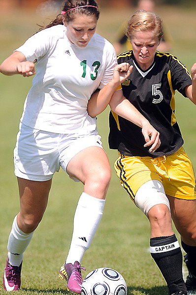 &lt;p&gt;Whitefish junior forward Megan Danczyk (13) pushes past
Stevensville defender Megan Greene during the first half of
Friday&#146;s soccer match in Whitefish.&lt;/p&gt;