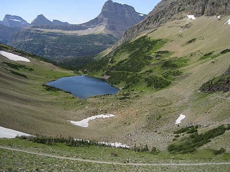 &lt;p&gt;The view from Ptarmigan Tunnel shows Ptarmigan Lake and the mountains of Glacier National Park in the background.&lt;/p&gt;